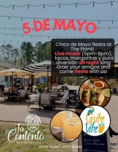Event flyer for a Cinco de Mayo fiesta at The Plant in Pittsboro, featuring live music from 5 PM to 8 PM, tacos, and margaritas. The background shows The Plant's outdoor patio with café tables, striped umbrellas, and string lights overhead. Inset photos show tacos with salsas and two margaritas. Logos for Ta Contento Mex Fresh Food and Caribe Vibe appear at the bottom. Copy reads: "Grab your amigos and come fiesta with us!"